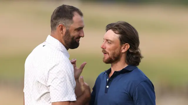 Scheffler and Fleetwood shake hands