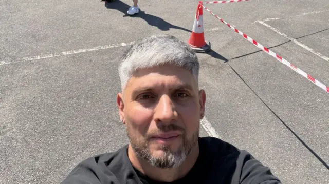 Chef Damian Wawrzyniak taking a selfie at the venue where he is catering
