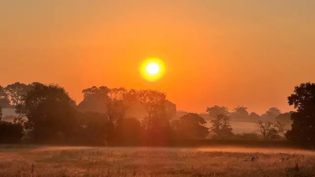 Sunrise over Church Broughton in Derbyshire