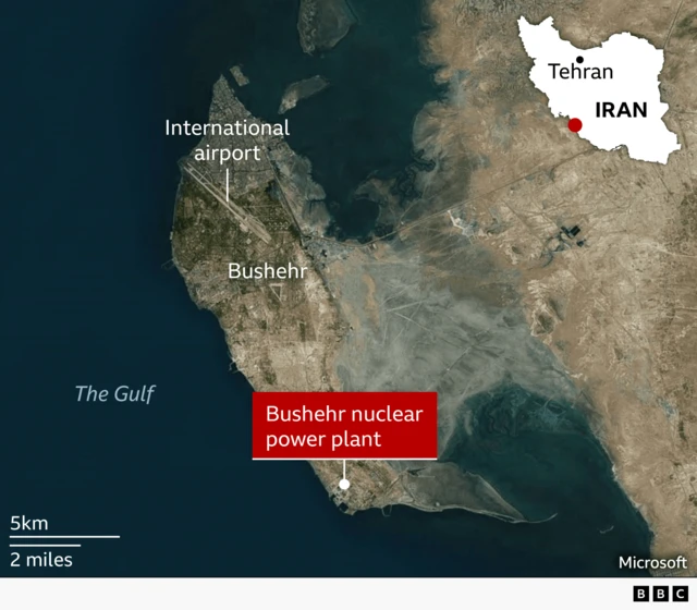 A satellite map of southwestern Iran showing the city of Bushehr on the coast of the Gulf. The Bushehr nuclear power plant is marked with a red label near the southern tip of the peninsula. The international airport is labelled just northwest of the city.