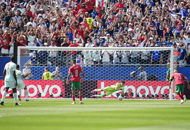 Yassine Bounou of Morocco stops the penalty shooted by Kylian Mbappe