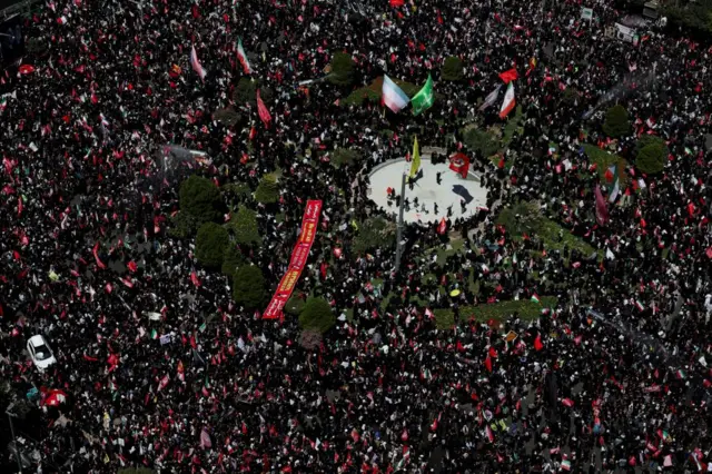An aerial of mourners gathering in Mashhad