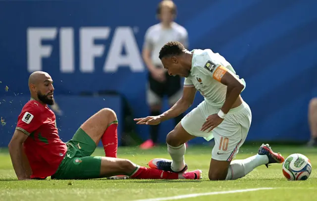 Mazraoui brings down Mbappe for the penalty