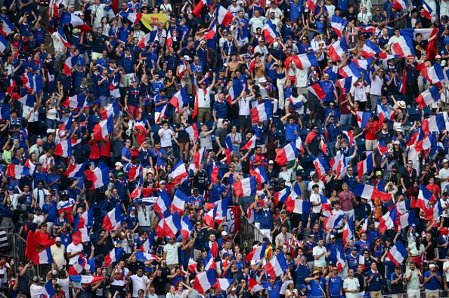 France fans wave flags after France won