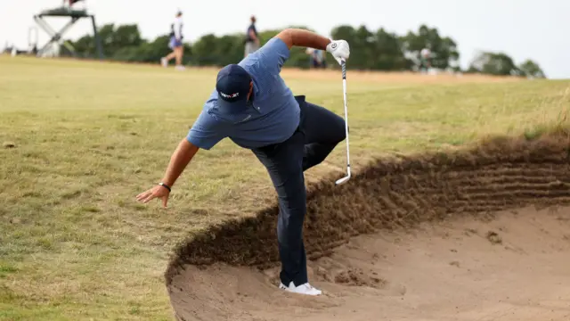 Patrick Reed took a tumble in the bunker on 16