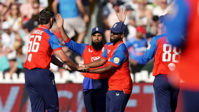 Josh Tongue and England celebrate a wicket