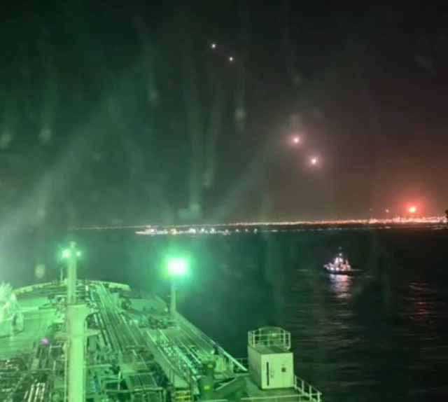 The seafarers shared footage of projectiles being launched over ships near the strait