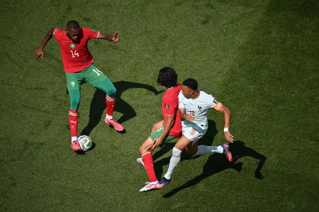 Morocco players hold off the press from Mbappe