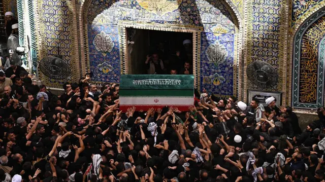 Mourners carry the coffin of Iran's slain supreme leader Ali Khamenei at the Imam Ali shrine in Najaf on July 8, 2026.
