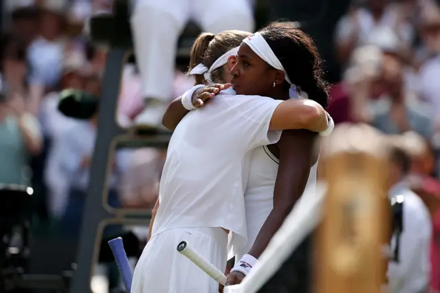 Muchova and Gauff hug
