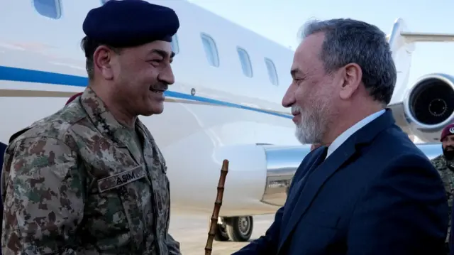Iranian Foreign Minister Abbas Araqchi welcomes Pakistan army chief Asim Munir at an airport in Tehran, Iran, April 15, 2026