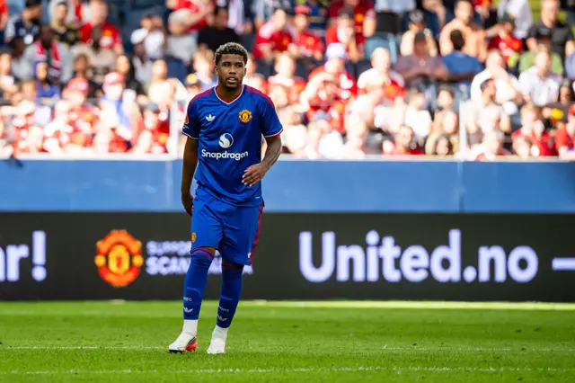 Andrey Santos on the pitch in Manchester United's blue away kit