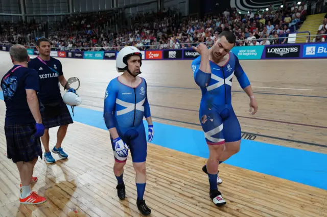 Neil Fachie and Aaron Pope walk off the track after their crash