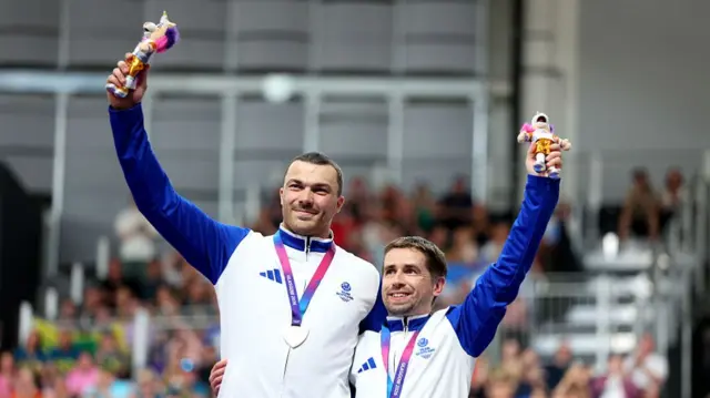 Aaron Pope and Neil Fachie on the podium with their medals