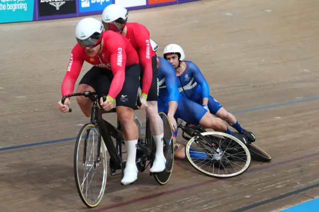 Aaron Pope and Neil Fachie fall after crashing into James Ball's back wheel