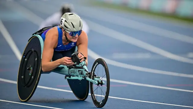Scotland's Melanie Woods reacts after arriving first in the women's 400m T54 heat 1
