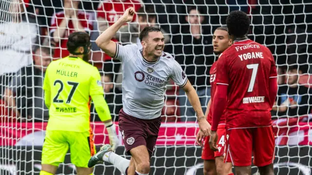 Oisin McEntee celebrates after scoring for Hearts against Aberdeen