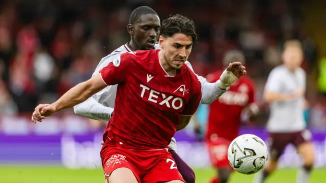 Hearts' Amadou Ba-Sy and Aberdeen's Dan Happe