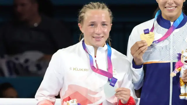 Ruby White holds up her silver medal