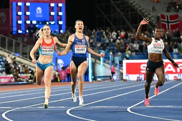 Britain's Amy Hunt (C) celebrates as she crosses the finish line