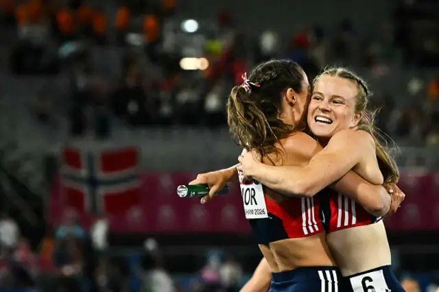 Norway's Henriette Jaeger (R) celebrates with Norway's Amalie Iuel (R) after crossing the finish line