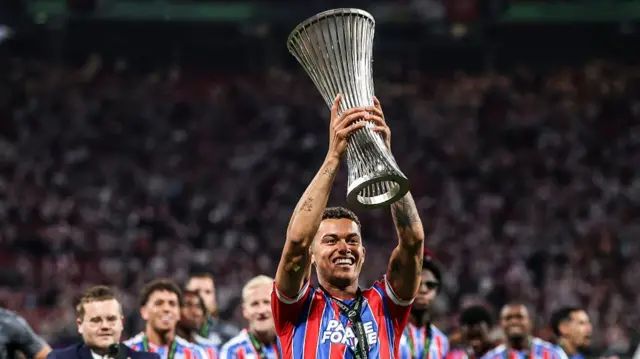 Brennan Johnson of Crystal Palace celebrates with the UEFA Conference League trophy