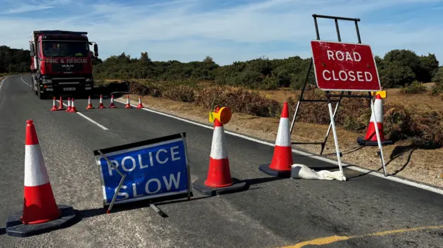Cones and road closed sign