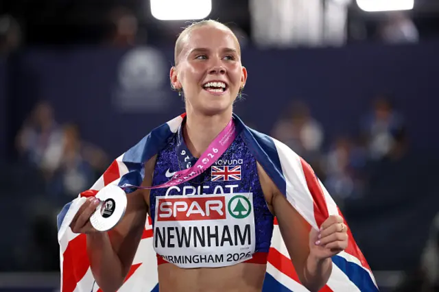 Silver medalist, Emily Newnham of Team Great Britain, celebrates with her medal and the national flag after the Women's 400m Hurdles Final during day three of the 27th European Athletics Championships at Alexander Stadium on August 12, 2026 in Birmingham, England.
