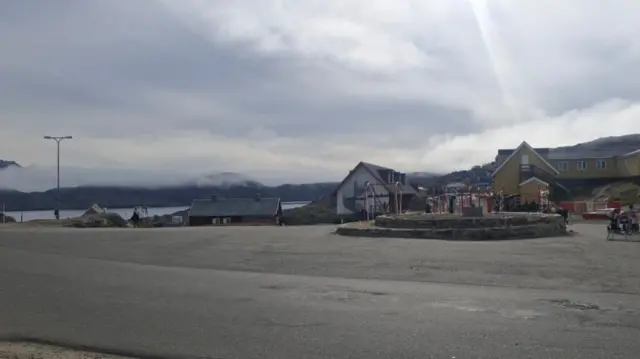 A cloudy sky above the town of Tasiilaq in Greenland