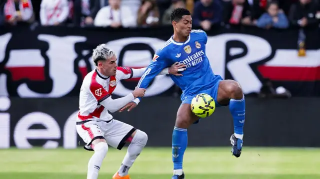 Jude Bellingham of Real Madrid and Pep Chavarria of Rayo Vallecano fight for the ball during the LaLiga EA Sports 2025/26 match between Rayo Vallecano and Real Madrid