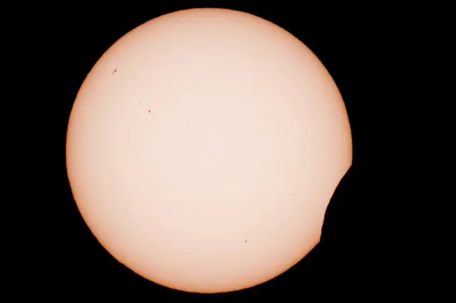 Large sun against black sky