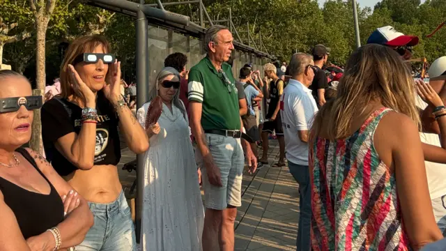 People watching the eclipse in Benevente, near Zamora in Spain