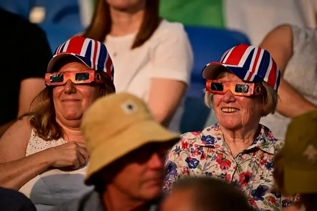 Members of the public watch the solar eclipse during the European Athletics Championships at Alexander Stadium in Birmingham on August 12, 2026