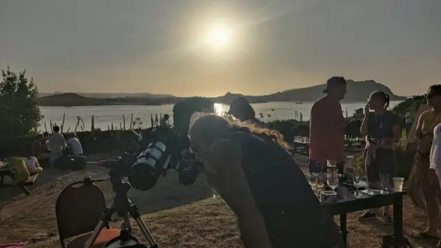 Chris Hankey looking into his telescope