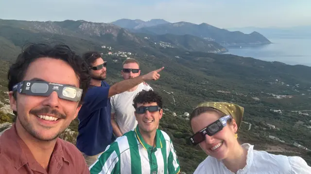 BBC journalist Emily Atinson with friends in Corsica ahead of eclipse