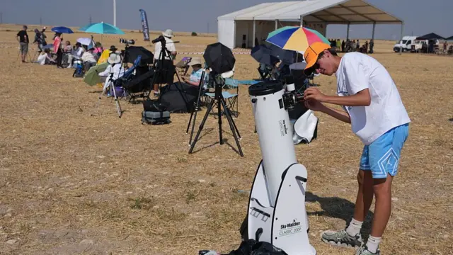 Astronomy enthusiasts make their final adjustments in the hours leading up to the total solar eclipse observation in Lodoso, Burgos province, on August 12, 2026.