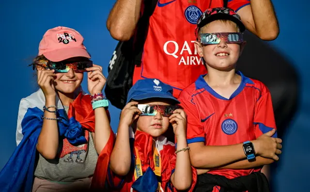Supporters watch the solar eclipse during day three of the European Athletics Championships 2026 at Alexander Stadium in Birmingham, England