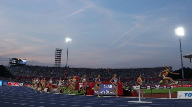 Athletes compete at dusk in the 3000m Steeplechase Women final at the European