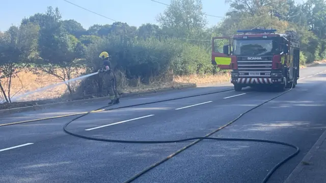 Firefighter and hose