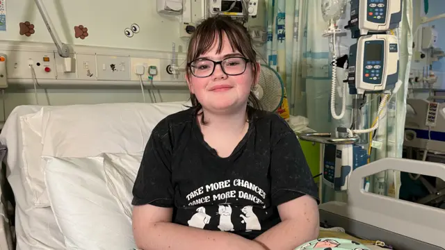 April sits in a hospital