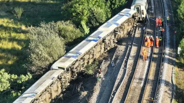 Damaged carriages on their side as seen from above