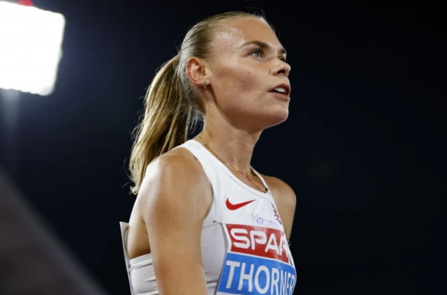 Elise Thorner of Britain reacts after a Women's 3000m steeplechase