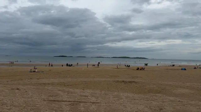 A quiet beach in Northern Ireland with grey skies overhead