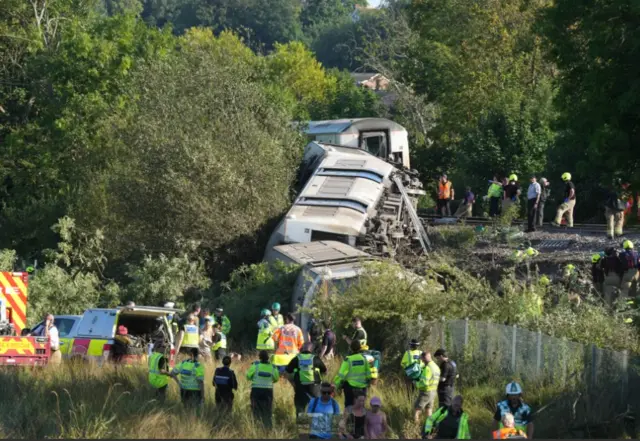 Carriages of the train off the tracks.