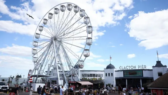 General view of Clacron seafront with the pier and a ferris wheel