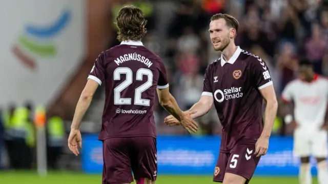 Hearts' Tomas Bent Magnusson celebrates with Jamie McCart after scoring the opener