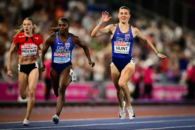 Britain's Amy Hunt (R) cross the finsh line past Britain's Dina Asher-Smith