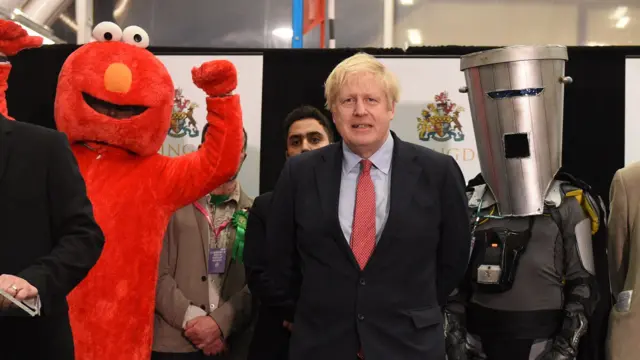 Count Binface at the 2019 Uxbridge general election count alongside Boris Johnson and Elmo