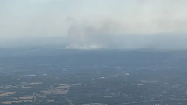 Photos of plane of smoke rising