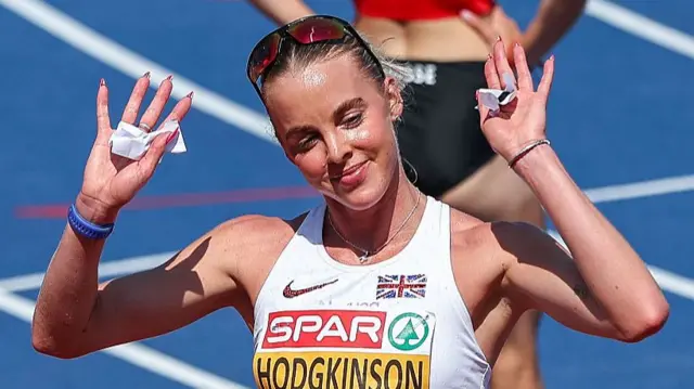 Keely Hodgkinson puts her hands up after cruising through her heat